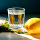 Glass of water with lemon and rosemary for hydration Glass of water with lemon and rosemary for hydration - PhotoDune Item for Sale