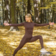 Woman Practicing Yoga Warrior Pose in Autumn Forest During Outdoor Workout Woman Practicing Yoga Warrior Pose in Autumn Forest During Outdoor Workout - PhotoDune Item for Sale