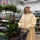 Senior woman walking with shopping cart in the plant section of a large store Senior woman walking with shopping cart in the plant section of a large store - PhotoDune Item for Sale