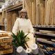 Woman pushing a shopping cart filled with home improvement items in a store Woman pushing a shopping cart filled with home improvement items in a store - PhotoDune Item for Sale