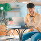 Happy smiling student with book in hand on campus while going to study for learning. Happy smiling student with book in hand on campus while going to study for learning. - PhotoDune Item for Sale