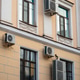 Facade of building with many air conditioners on windows in southern hot country. Escape from heat Facade of building with many air conditioners on windows in southern hot country. Escape from heat - PhotoDune Item for Sale