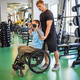 Disabled athlete under sports trainer guidance workout, correct form and tracking progress in gym Disabled athlete under sports trainer guidance workout, correct form and tracking progress in gym - PhotoDune Item for Sale