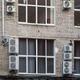Facade of building with many air conditioners on windows in southern hot country. Escape from heat Facade of building with many air conditioners on windows in southern hot country. Escape from heat - PhotoDune Item for Sale
