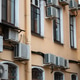 Facade of building with many air conditioners on windows in southern hot country. Escape from heat Facade of building with many air conditioners on windows in southern hot country. Escape from heat - PhotoDune Item for Sale