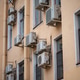 Facade of building with many air conditioners on windows in southern hot country. Escape from heat Facade of building with many air conditioners on windows in southern hot country. Escape from heat - PhotoDune Item for Sale