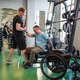 Caring sports coach aid athlete in wheelchair transfer after completing challenging training workout Caring sports coach aid athlete in wheelchair transfer after completing challenging training workout - PhotoDune Item for Sale