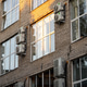 Facade of building with many air conditioners on windows in southern hot country. Escape from heat Facade of building with many air conditioners on windows in southern hot country. Escape from heat - PhotoDune Item for Sale