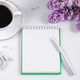 Spring flatlay. Notepad, lilac flowers and cup of coffee on light background. Spring flatlay. Notepad, lilac flowers and cup of coffee on light background. - PhotoDune Item for Sale