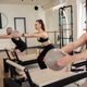 Group training on pilates reformers practicing fitness exercise Group training on pilates reformers practicing fitness exercise - PhotoDune Item for Sale