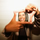 Happy young latin woman having fun at night time taking photos Happy young latin woman having fun at night time taking photos - PhotoDune Item for Sale