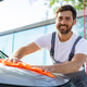 Man Washing Car with Orange Cloth Man Washing Car with Orange Cloth - PhotoDune Item for Sale
