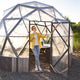 Woman Enjoy a Relaxing Moment in a Geodesic Structure at Sunset Woman Enjoy a Relaxing Moment in a Geodesic Structure at Sunset - PhotoDune Item for Sale