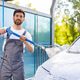Man Washing Car with Pressure Washer Man Washing Car with Pressure Washer - PhotoDune Item for Sale