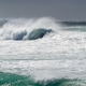 Powerful surf break with large breaking waves under overcast sky Powerful surf break with large breaking waves under overcast sky - PhotoDune Item for Sale