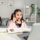 Asian young kid student learning online class with teacher at home. Asian young kid student learning online class with teacher at home. - PhotoDune Item for Sale