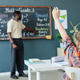 Schoolboy Raising Hand during Math Lesson in Elementary Classroom Schoolboy Raising Hand during Math Lesson in Elementary Classroom - PhotoDune Item for Sale