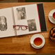 Vintage Family Photo Album Evoking Nostalgia during Tea Break Vintage Family Photo Album Evoking Nostalgia during Tea Break - PhotoDune Item for Sale