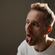 Adult Man Showing Tongue during Psychiatric Evaluation Session Adult Man Showing Tongue during Psychiatric Evaluation Session - PhotoDune Item for Sale