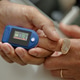 Senior Patient Undergoing Pulse Oximeter Check during Clinic Visit Senior Patient Undergoing Pulse Oximeter Check during Clinic Visit - PhotoDune Item for Sale