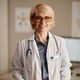 Portrait of Middle Aged Woman Pediatrician Standing in Office Portrait of Middle Aged Woman Pediatrician Standing in Office - PhotoDune Item for Sale