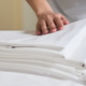 Adult Woman Folding Clean Bed Linens for Hospitality Service Adult Woman Folding Clean Bed Linens for Hospitality Service - PhotoDune Item for Sale