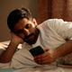 Adult Man Using Smartphone in Bed Showing Digital Fatigue at Home Adult Man Using Smartphone in Bed Showing Digital Fatigue at Home - PhotoDune Item for Sale
