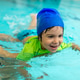 Laughing boy lies flat on water surface supported by a female instructor, practicing front glide tec Laughing boy lies flat on water surface supported by a female instructor, practicing front glide tec - PhotoDune Item for Sale