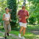 Senior man enjoying a guided cardio jogging workout with a fitness coach in a park to improve endura Senior man enjoying a guided cardio jogging workout with a fitness coach in a park to improve endura - PhotoDune Item for Sale