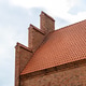 Medieval castle architecture showing red brick wall and roof tiles Medieval castle architecture showing red brick wall and roof tiles - PhotoDune Item for Sale