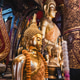 Golden Buddha statue inside a traditional Buddhist temple in Laos Golden Buddha statue inside a traditional Buddhist temple in Laos - PhotoDune Item for Sale