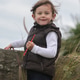 Cute Toddler Girl Standing Outdoors in Windy Weather Cute Toddler Girl Standing Outdoors in Windy Weather - PhotoDune Item for Sale