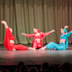Three odalisques in vibrant costumes performing traditional dance on stage Three odalisques in vibrant costumes performing traditional dance on stage - PhotoDune Item for Sale