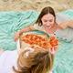 Young women sharing pepperoni pizza on blanket at sandy beach Young women sharing pepperoni pizza on blanket at sandy beach - PhotoDune Item for Sale