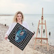 Young woman holding abstract artwork on Rocky Beach with easel and ocean background Young woman holding abstract artwork on Rocky Beach with easel and ocean background - PhotoDune Item for Sale
