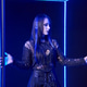 Young woman with long black hair in gothic attire standing in blue neon light cube Young woman with long black hair in gothic attire standing in blue neon light cube - PhotoDune Item for Sale