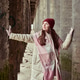 Adult woman winter coat and scarf cold weather urban columns Adult woman winter coat and scarf cold weather urban columns - PhotoDune Item for Sale