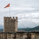 View of the fortress in Skopje with the national flag flying on a cloudy day View of the fortress in Skopje with the national flag flying on a cloudy day - PhotoDune Item for Sale