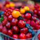Fresh fruits stacked in cups at a market in Prague during the summer season Fresh fruits stacked in cups at a market in Prague during the summer season - PhotoDune Item for Sale