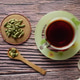 Warm cup of spiced tea with cardamom on a rustic table Warm cup of spiced tea with cardamom on a rustic table - PhotoDune Item for Sale