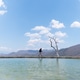 Young male traveler walks along the water at Hierve el Agua in Oaxaca, Mexico Young male traveler walks along the water at Hierve el Agua in Oaxaca, Mexico - PhotoDune Item for Sale