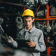 Technician male worker working in garage scrap yard old car part workshop warehouse Technician male worker working in garage scrap yard old car part workshop warehouse - PhotoDune Item for Sale