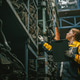 Technician adult women worker working in heavy industry, warehouse manager in garage scrap yard Technician adult women worker working in heavy industry, warehouse manager in garage scrap yard - PhotoDune Item for Sale