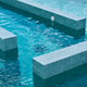 A modern pool with blue water and geometric concrete platforms. A modern pool with blue water and geometric concrete platforms. - PhotoDune Item for Sale