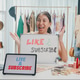 Young Asia lady beauty blogger wear crop top hold whiteboard smile looking at camera live stream tal Young Asia lady beauty blogger wear crop top hold whiteboard smile looking at camera live stream tal - PhotoDune Item for Sale