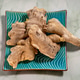Ginger roots resting on patterned turquoise plate top view Ginger roots resting on patterned turquoise plate top view - PhotoDune Item for Sale