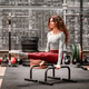 Woman performing L sit exercise on parallel bars in gym Woman performing L sit exercise on parallel bars in gym - PhotoDune Item for Sale