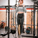 Woman performing weighted pull up during calisthenics workout Woman performing weighted pull up during calisthenics workout - PhotoDune Item for Sale
