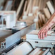 Carpenter Operating Table Saw in Woodworking Workshop Carpenter Operating Table Saw in Woodworking Workshop - PhotoDune Item for Sale