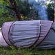 Outdoor camping tent with light smoke near trees, travel in nature, recreation and tourism, summer a Outdoor camping tent with light smoke near trees, travel in nature, recreation and tourism, summer a - PhotoDune Item for Sale